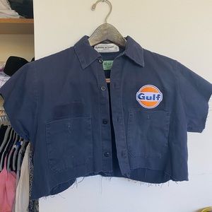 Super cute little button down top! Unique asf